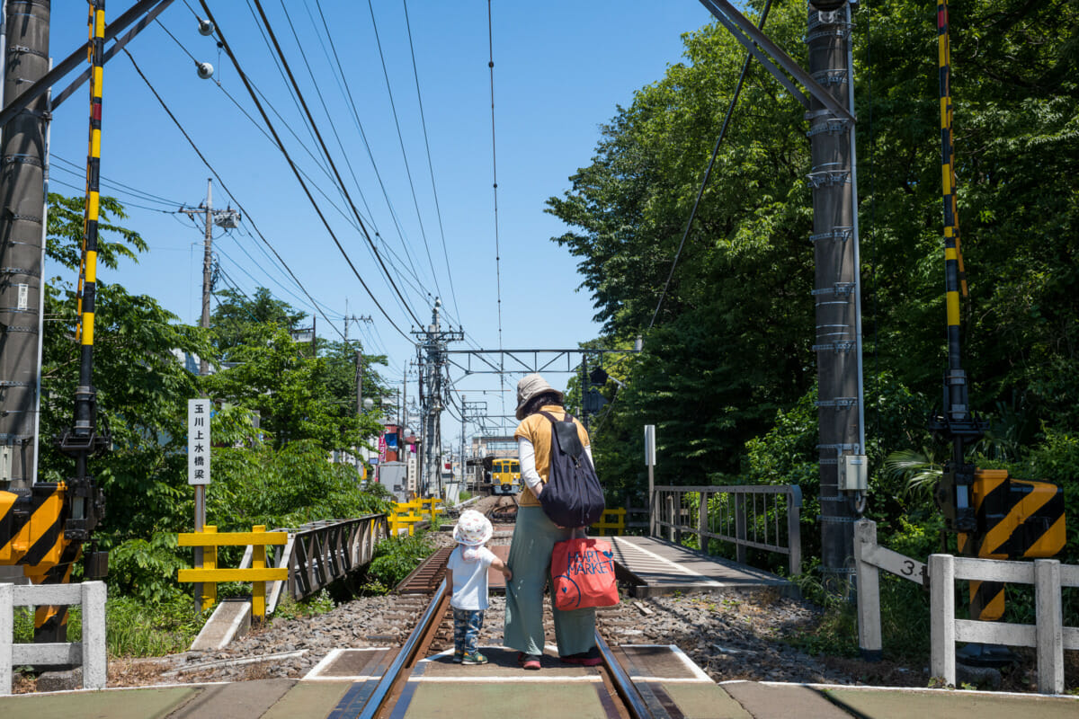 a little Japanese boy who loves trains