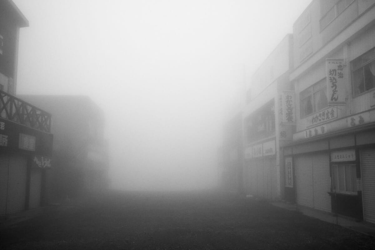 an old and faded Japanese tourist spot in the fog