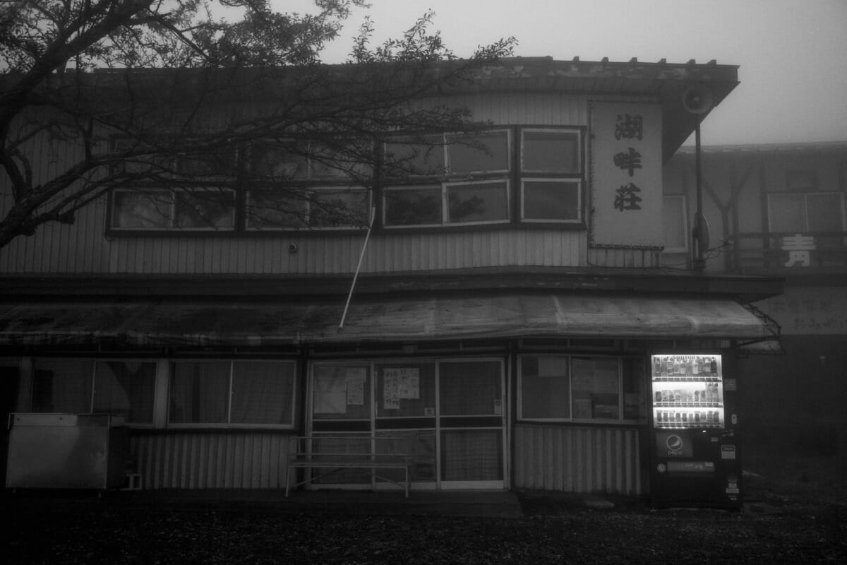 an old and faded Japanese tourist spot in the fog