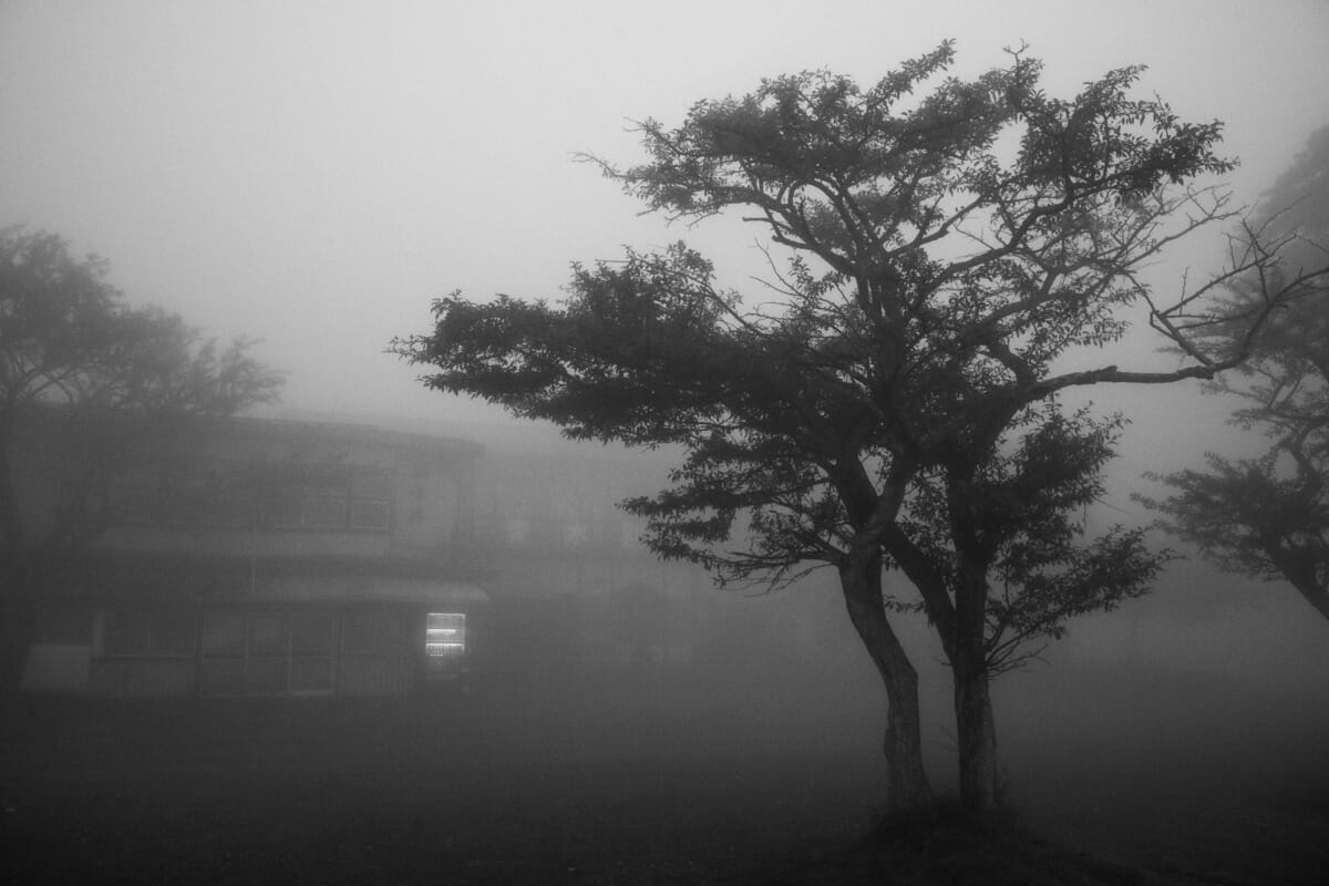 an old and faded Japanese tourist spot in the fog