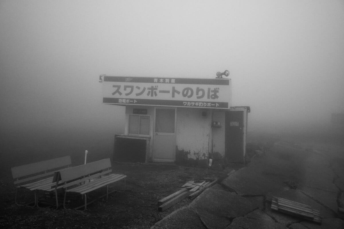 an old and faded Japanese tourist spot in the fog