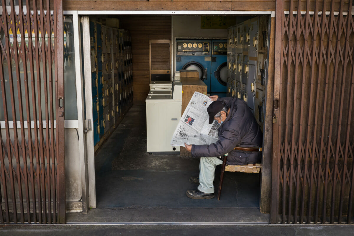 A dated Tokyo laundrette and its old-style scissor gates