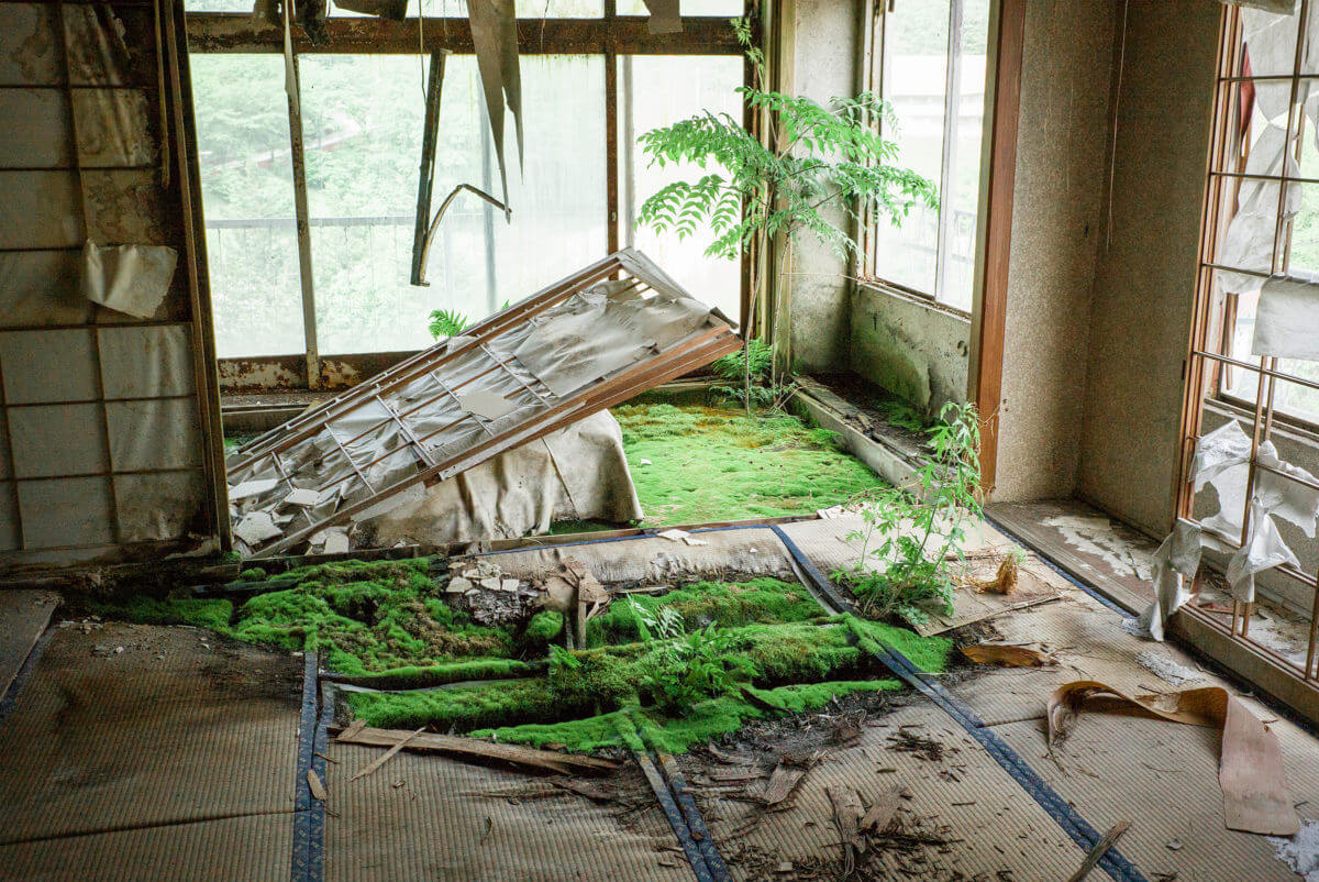 abandoned and overgrown japanese hotel