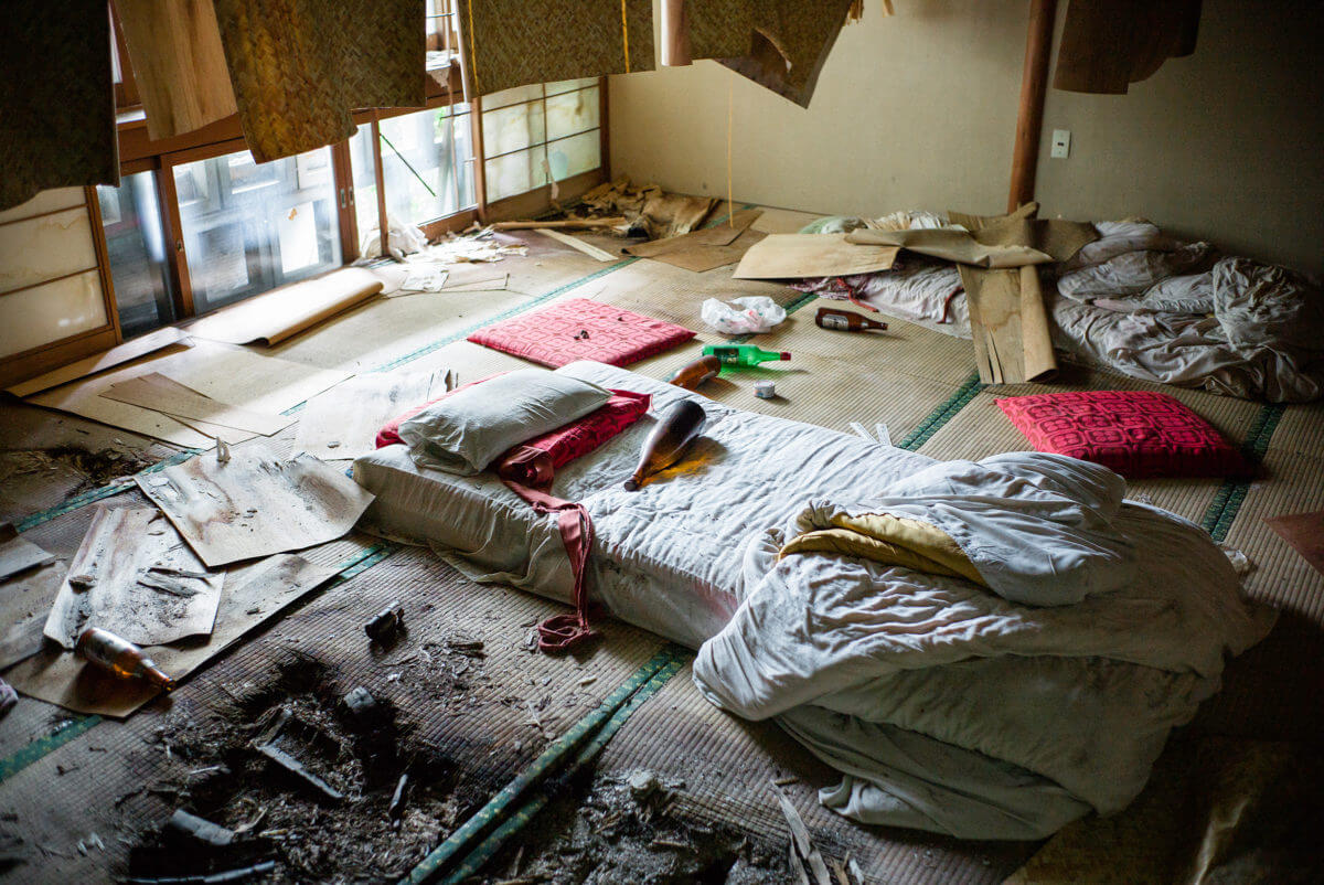 abandoned and overgrown japanese hotel