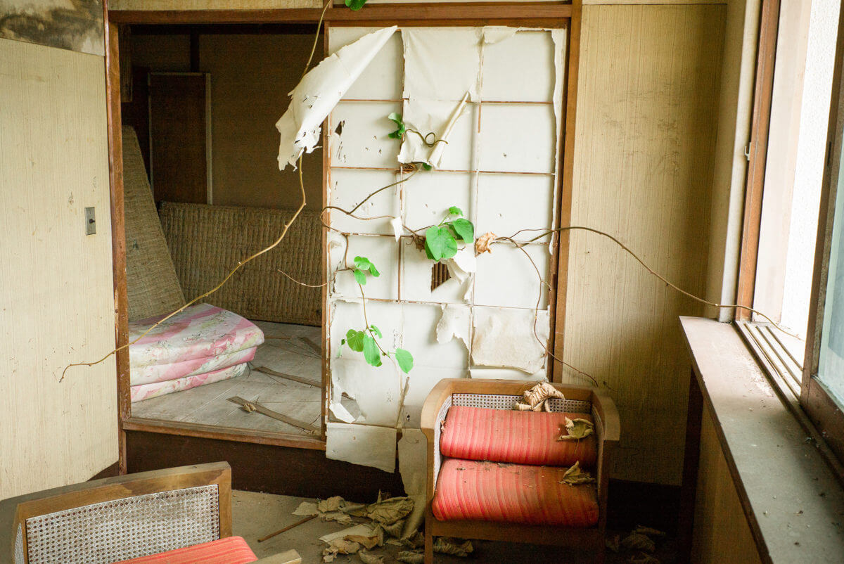 abandoned and overgrown japanese hotel