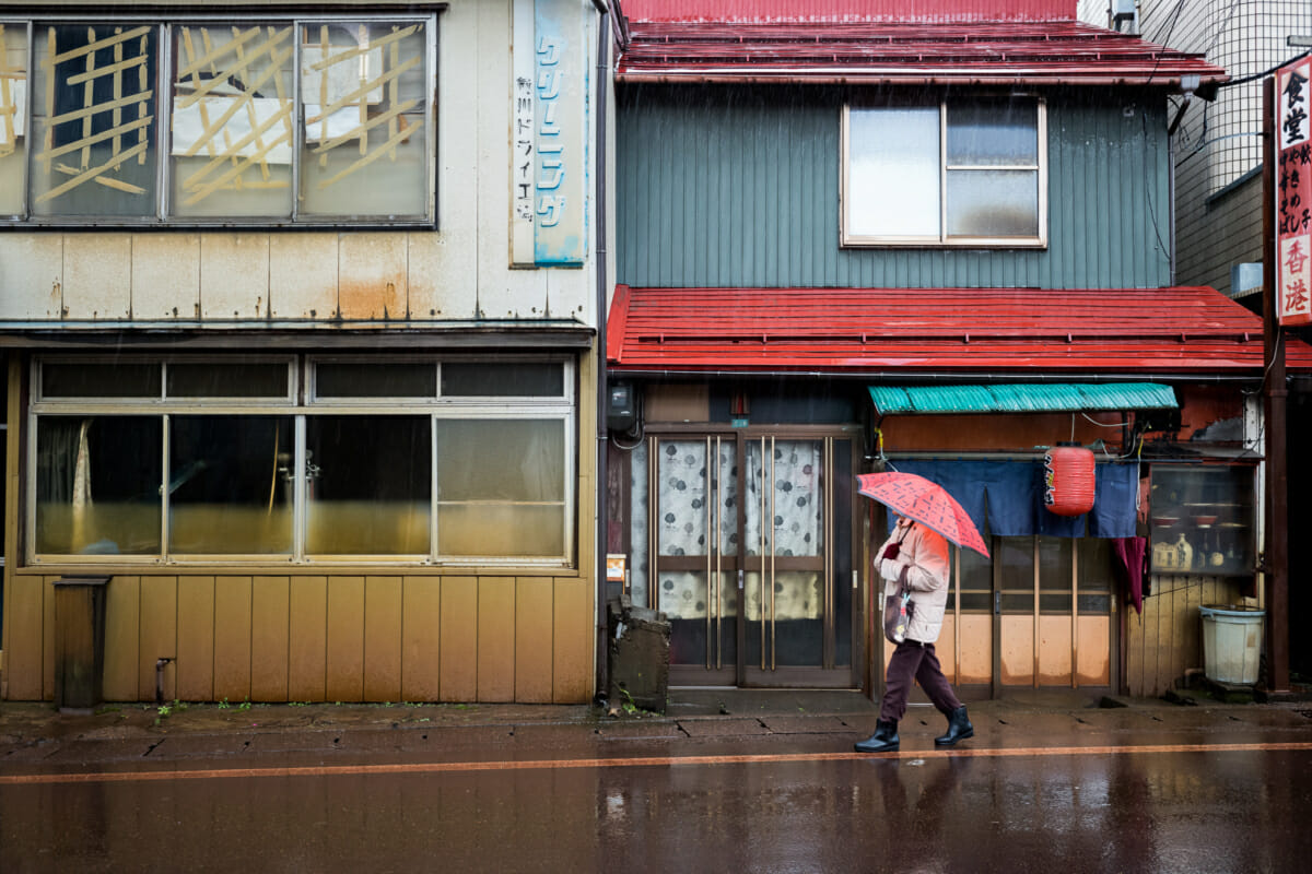 An elderly Japanese lady in her old ramen shop