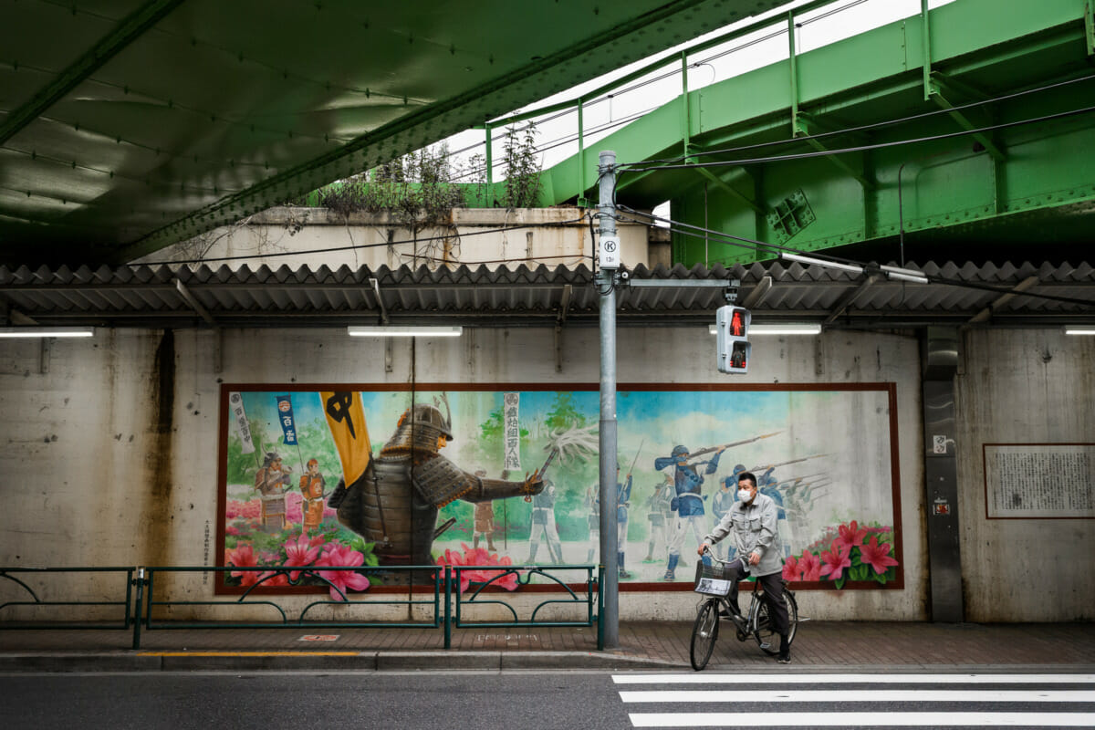 Ancient Tokyo gun squads, train tracks and traffic lights