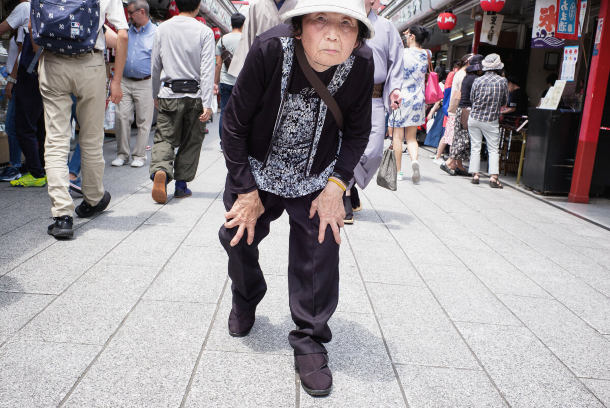 bent double old Japanese lady in Tokyo