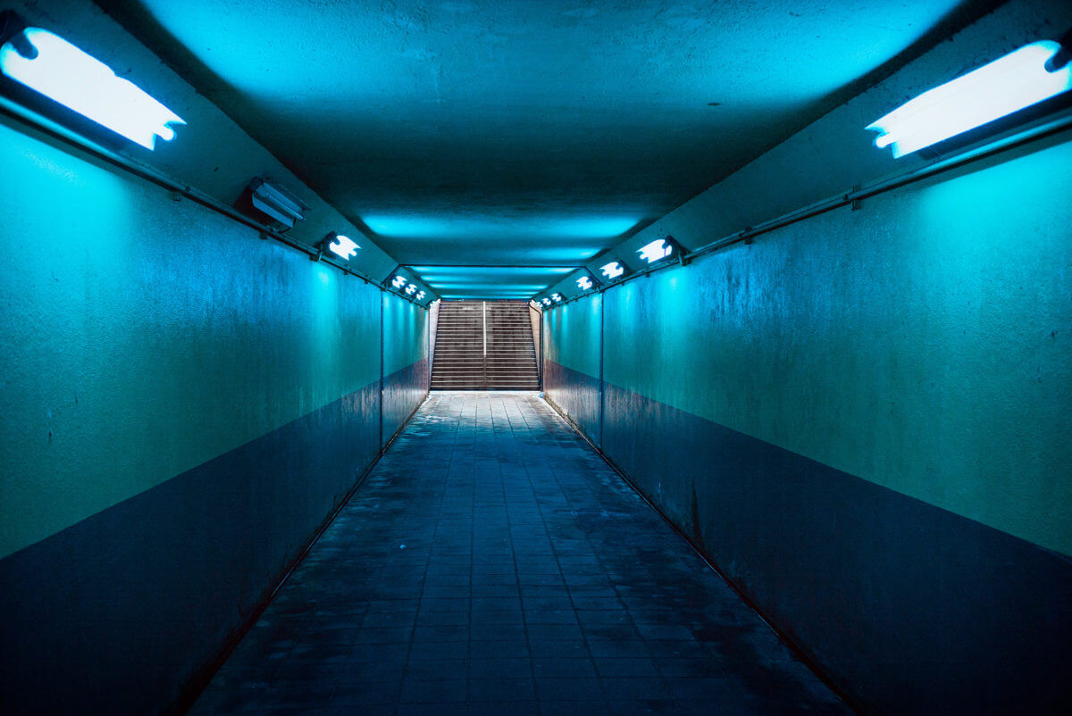 blue lit Japanese underpass