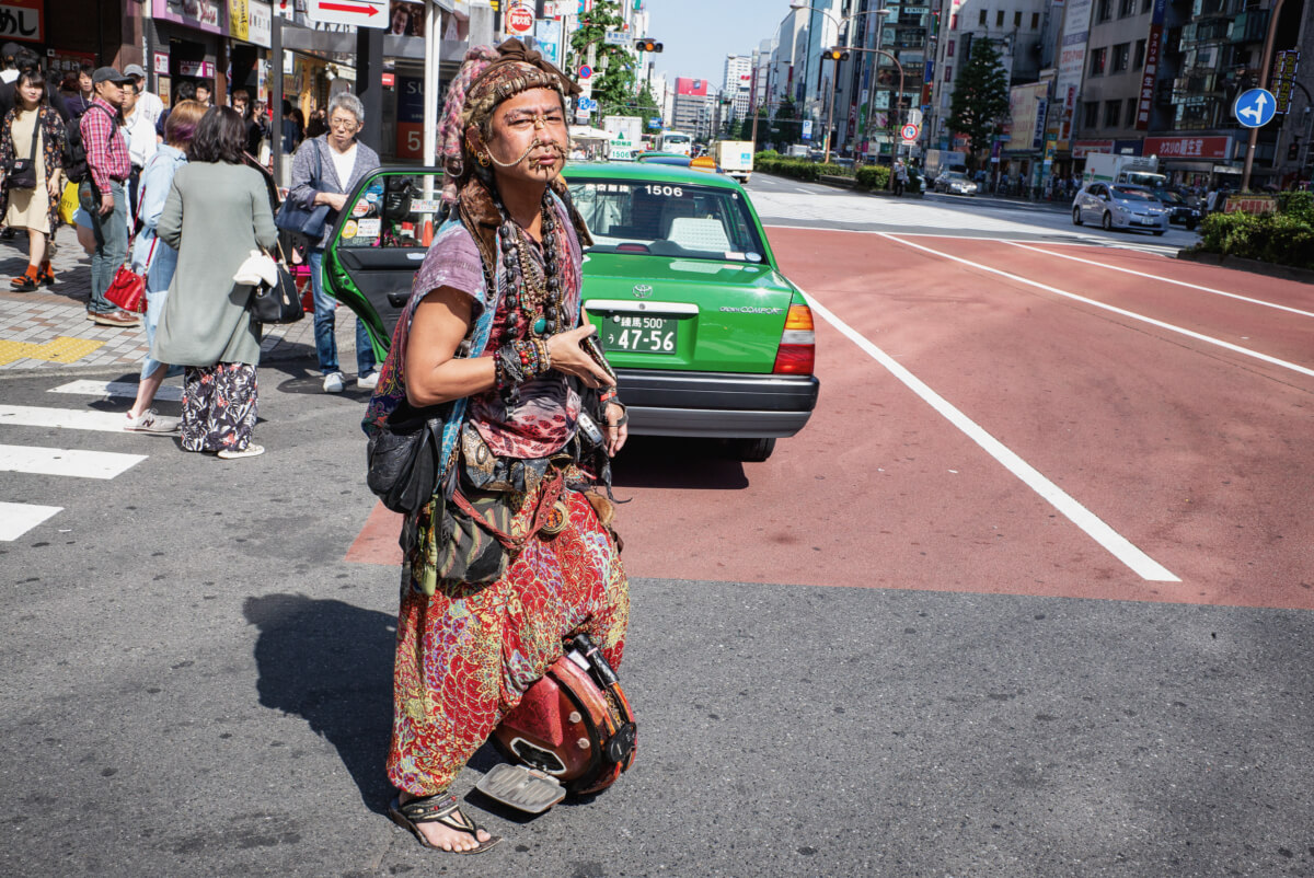 A colourful Japanese motorised unicycle rider