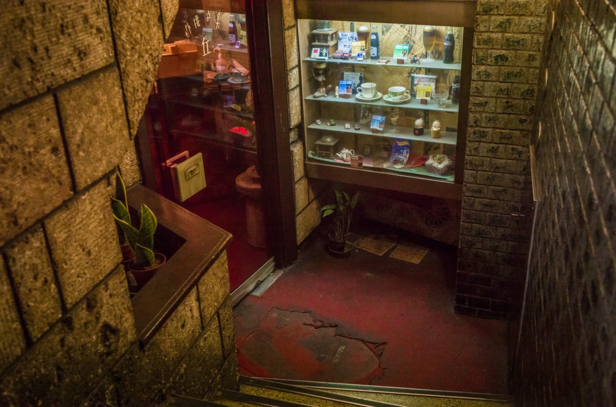 The dated colours and decor of an old Tokyo coffee shop