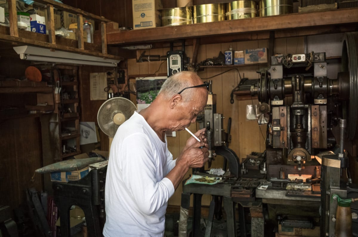 An octogenarian in his dated little Tokyo workshop