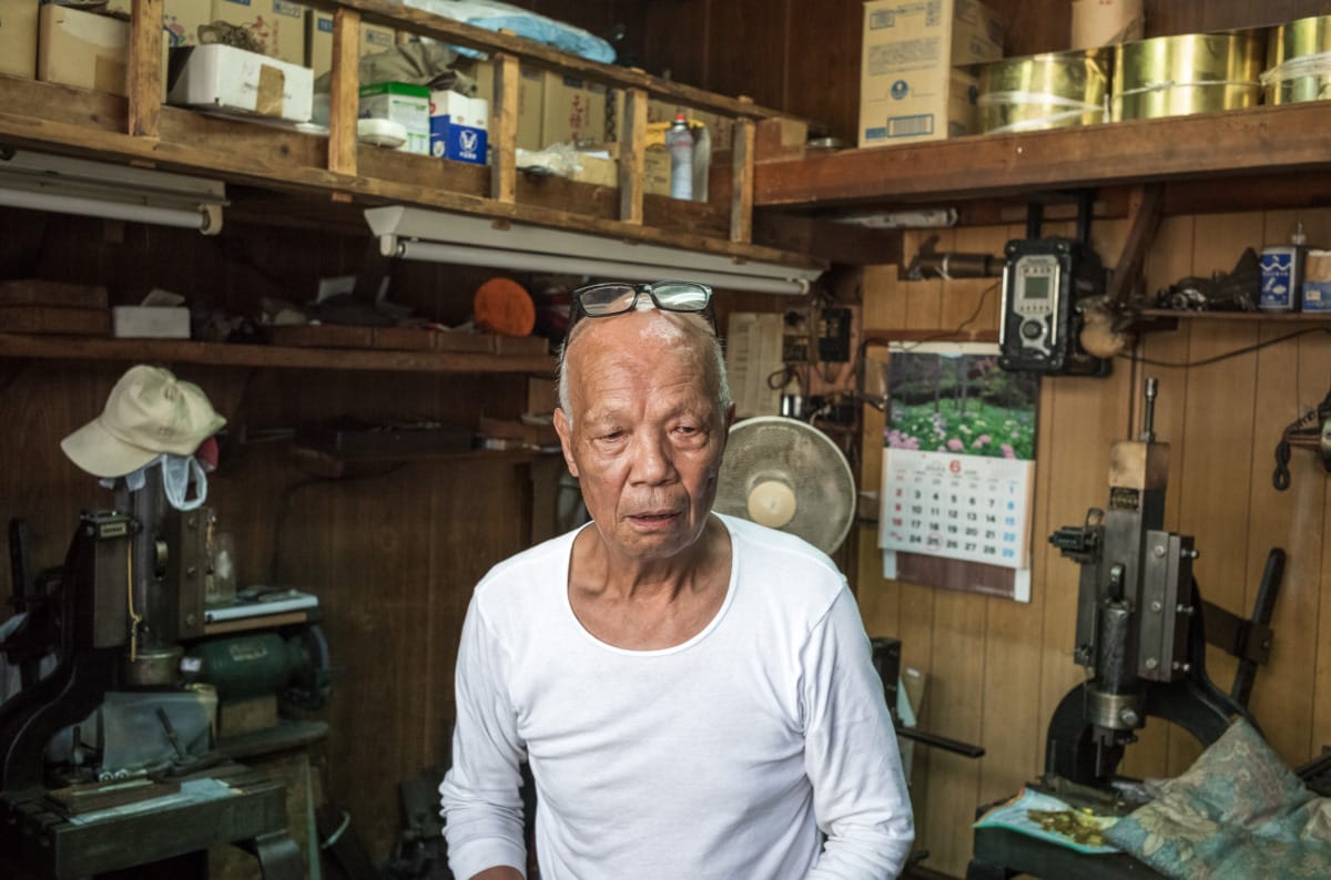 An octogenarian in his dated little Tokyo workshop