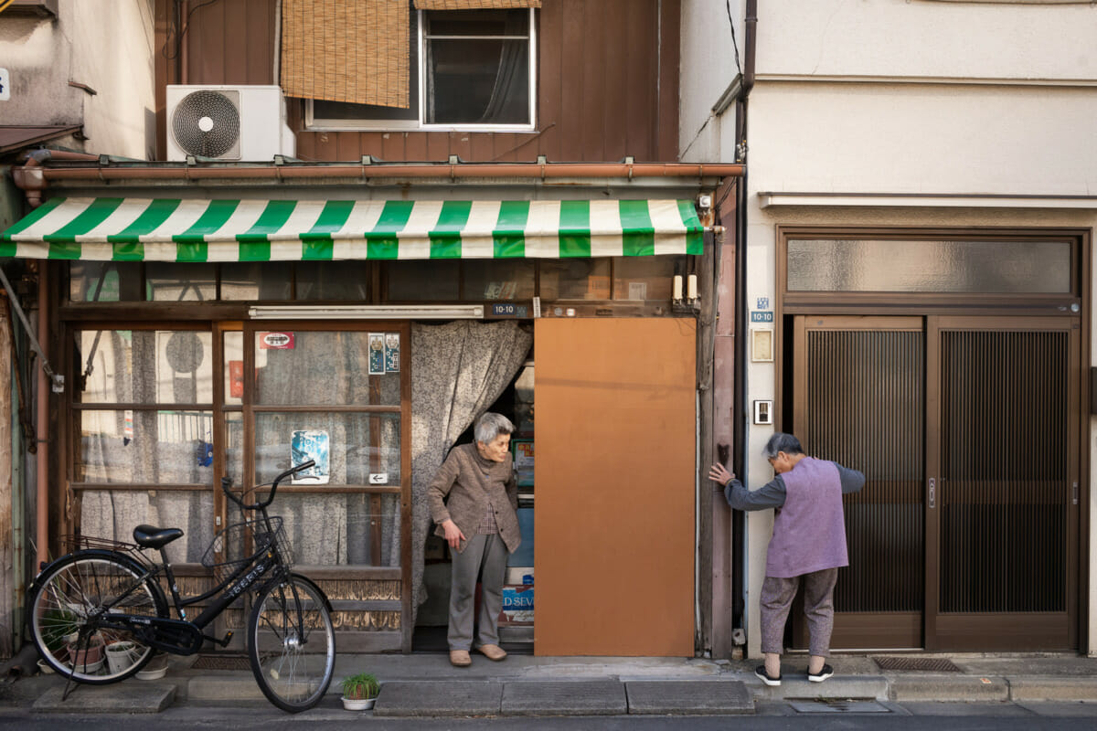 elderly Tokyo neighbours enjoying a chat