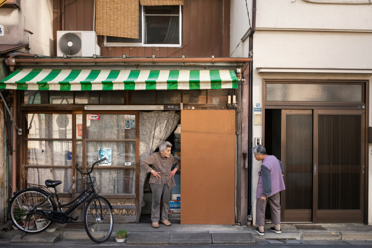 elderly Tokyo neighbours enjoying a chat