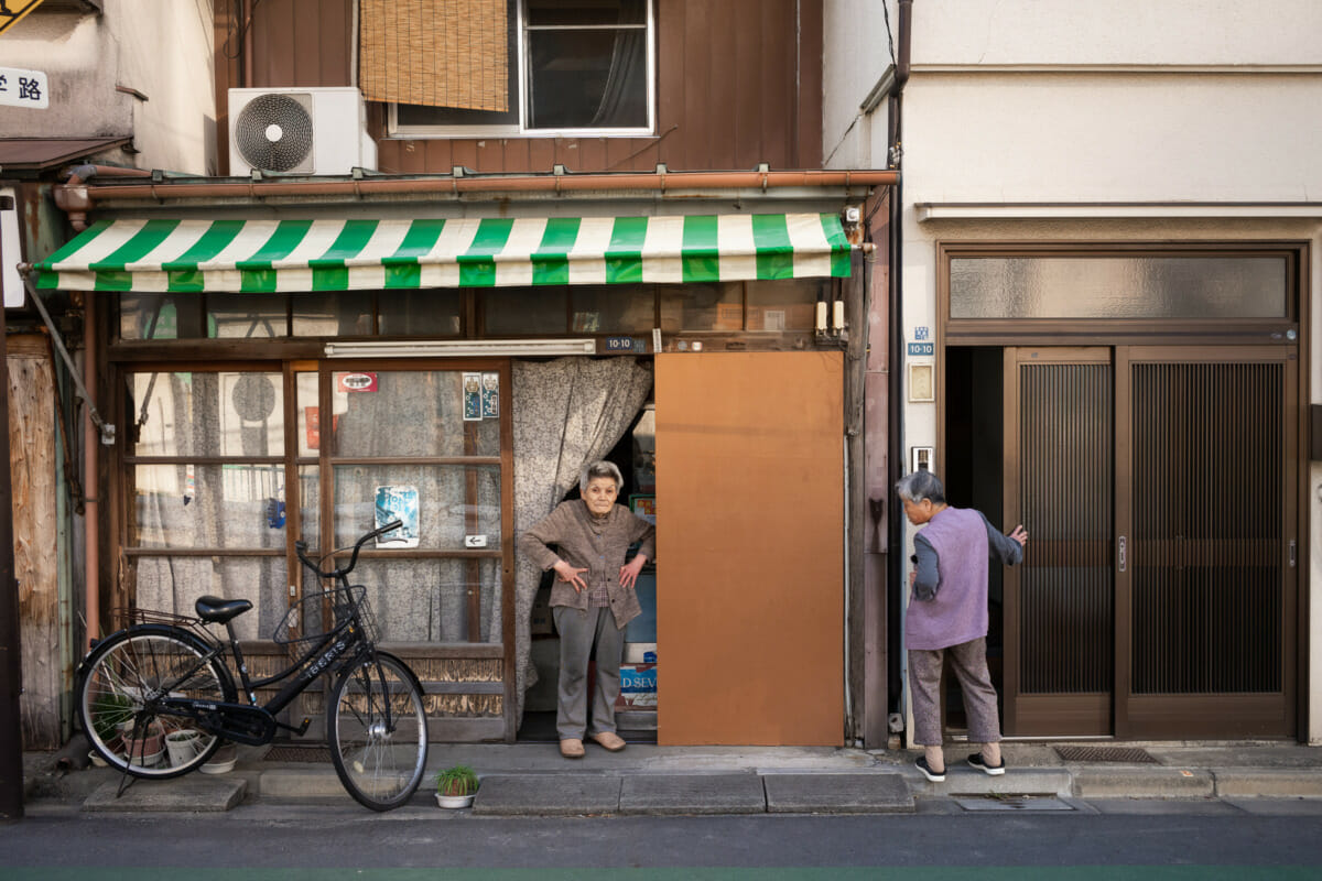 elderly Tokyo neighbours enjoying a chat