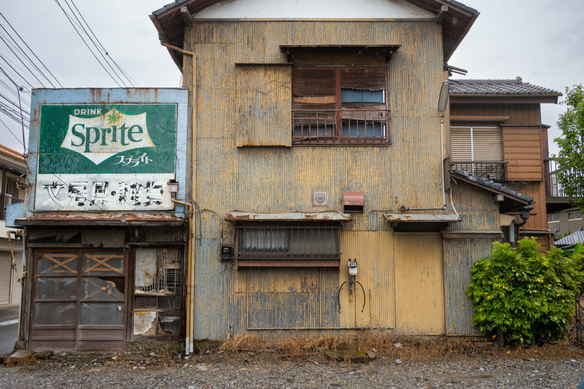 faded Tokyo Coca-Cola and Sprite signs