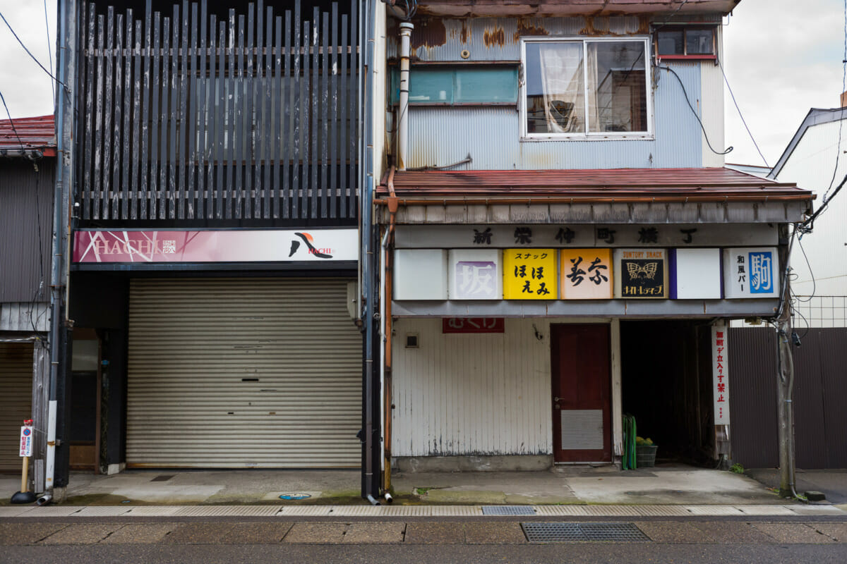 The faded traditional shop fronts of an old Japanese town