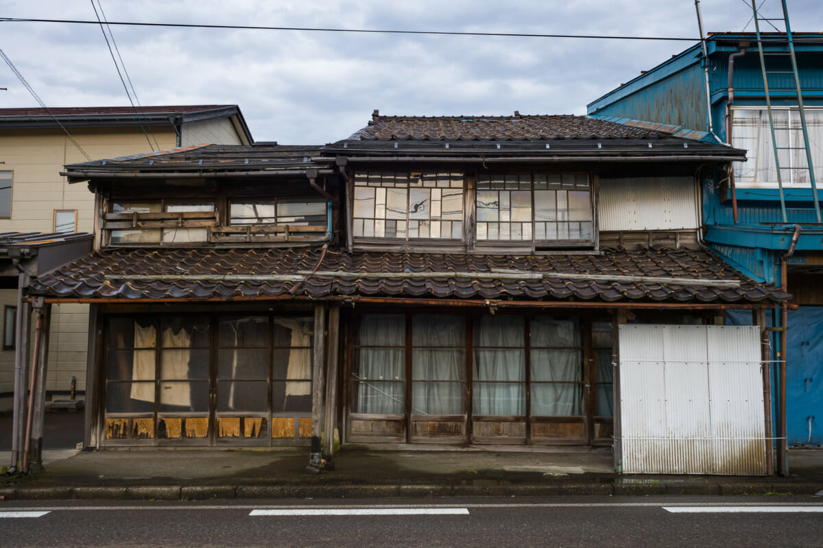 The faded traditional shop fronts of an old Japanese town