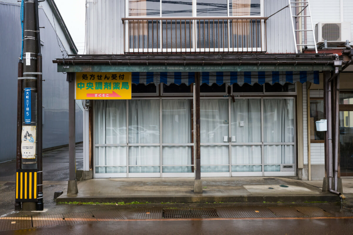 The faded traditional shop fronts of an old Japanese town