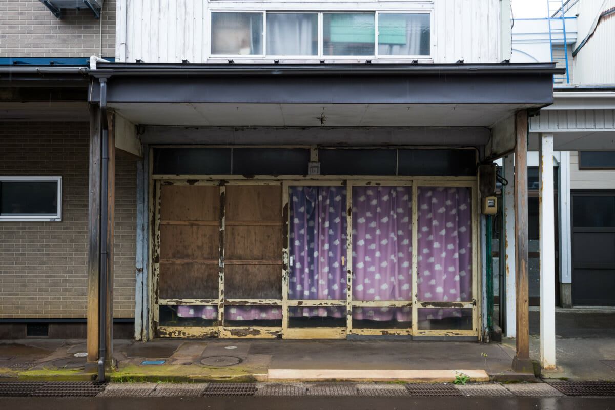 The faded traditional shop fronts of an old Japanese town