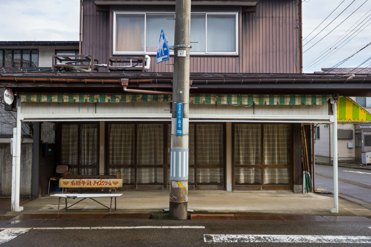 The faded traditional shop fronts of an old Japanese town