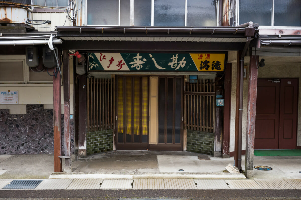 The faded traditional shop fronts of an old Japanese town