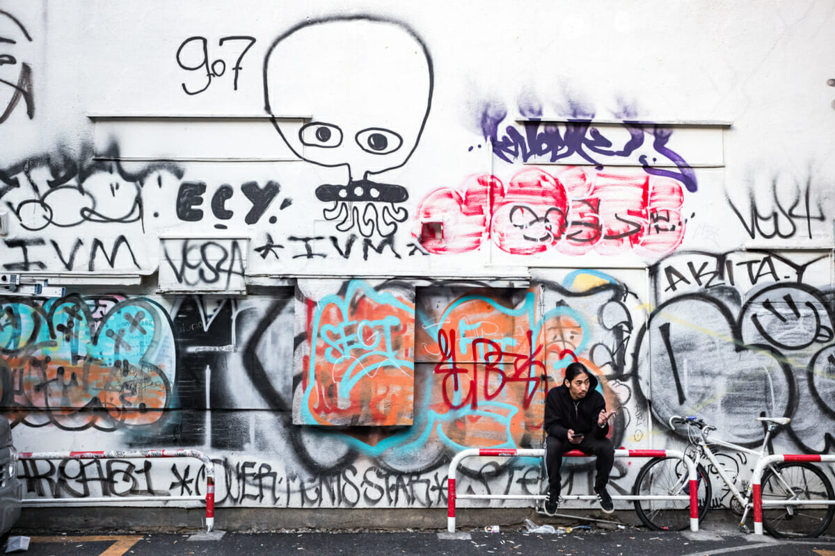 a graffiti covered wall in Tokyo