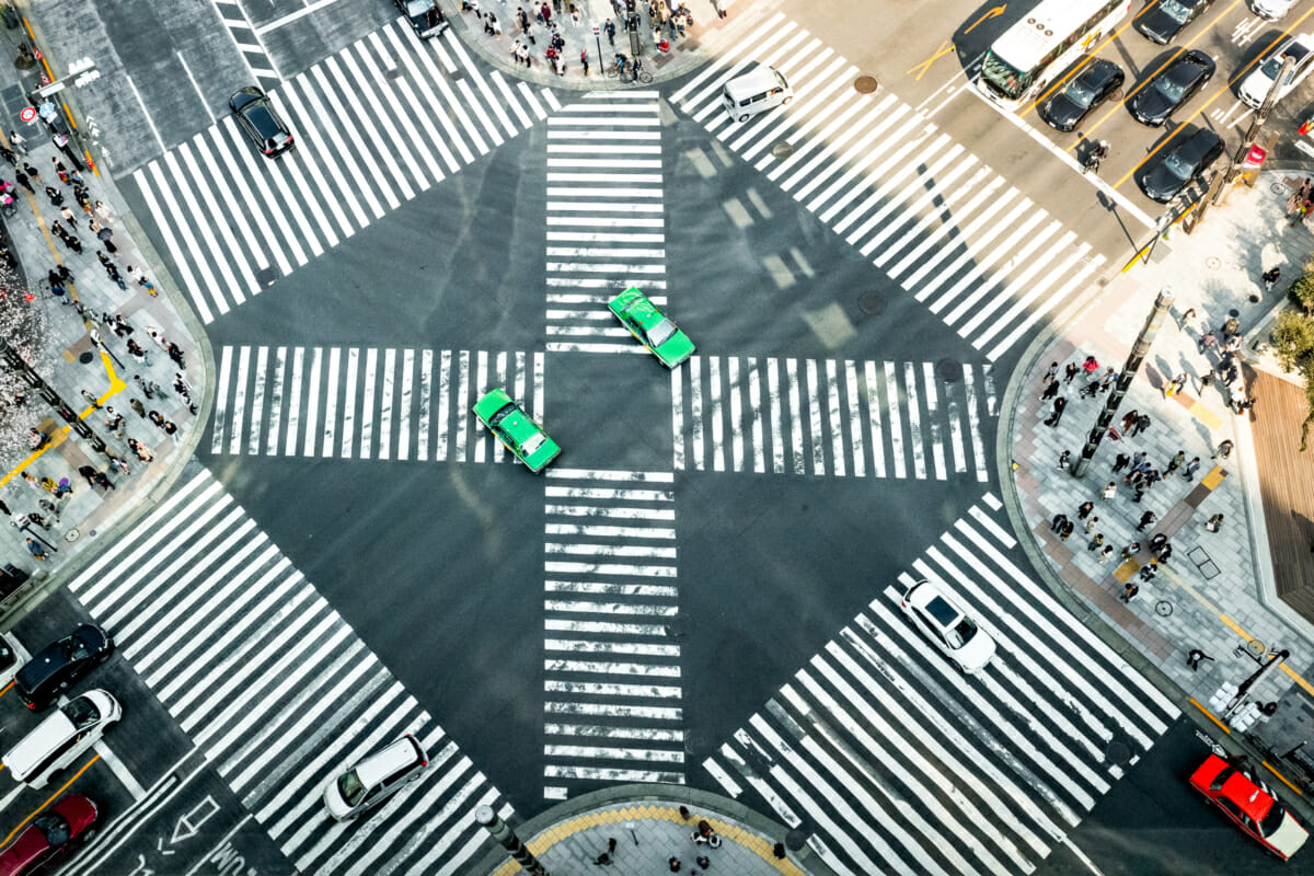 green taxis on a Tokyo crossing