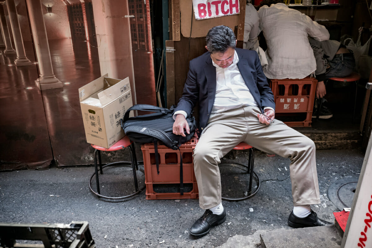 a Japanese drunk outside a very small Tokyo bar