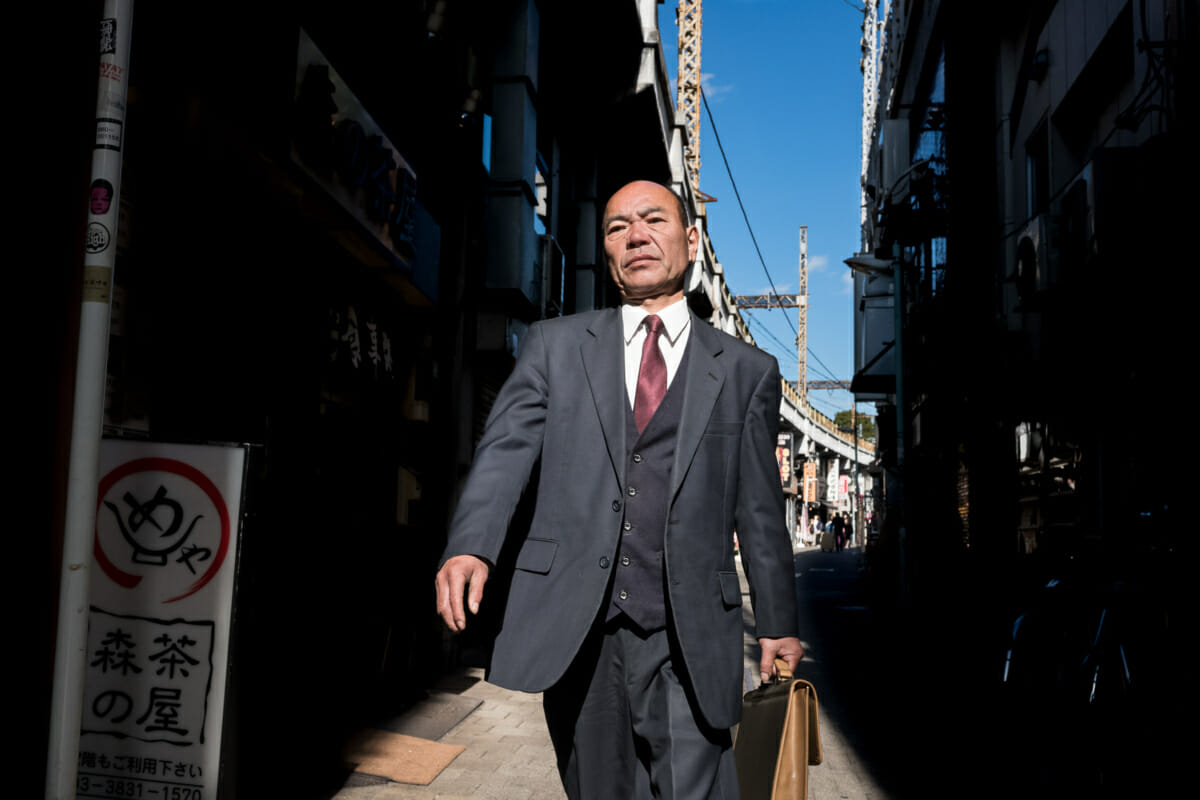 a swaggering Japanese salaryman in Tokyo