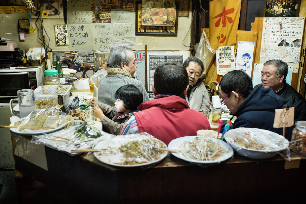 A little Japanese girl in a grubby little Tokyo bar