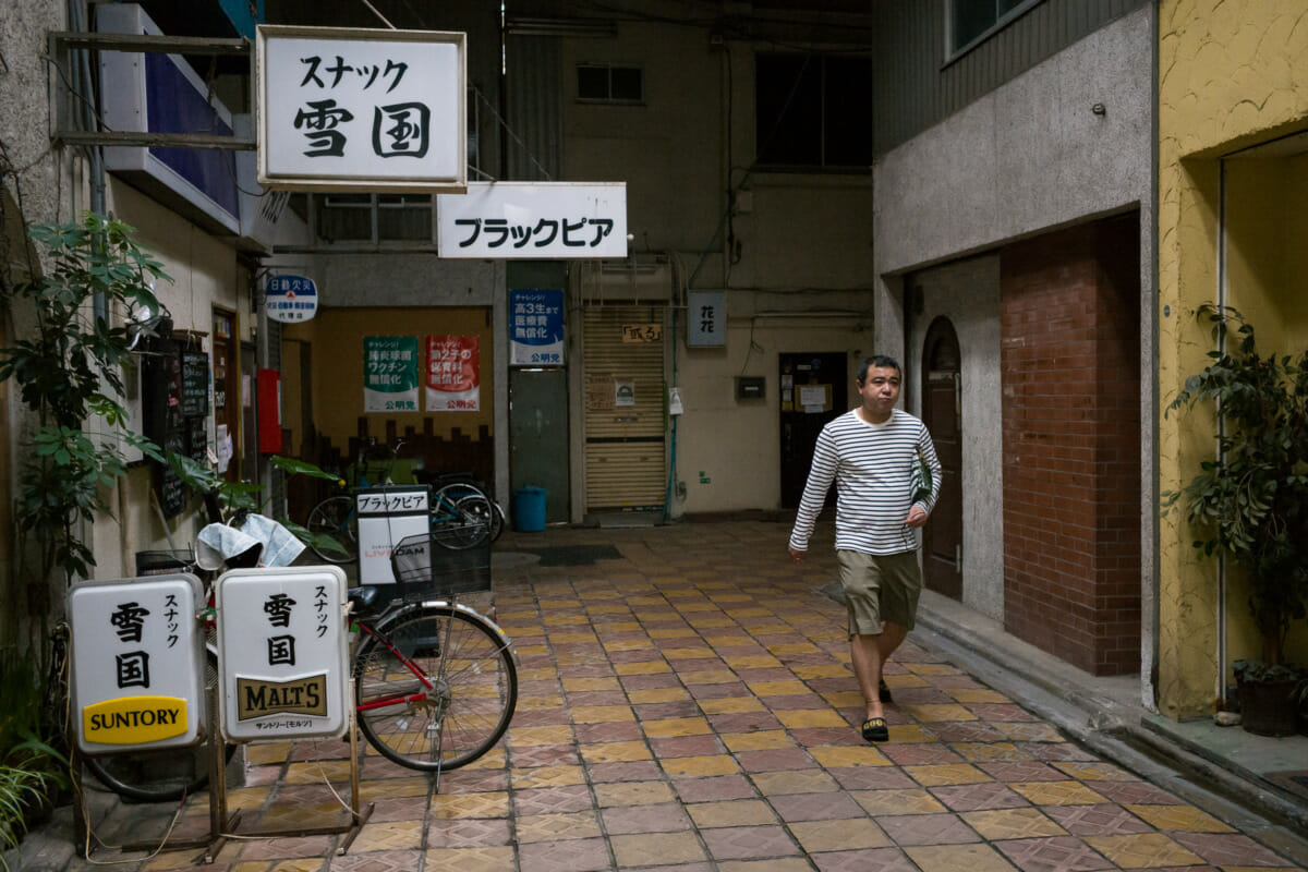 old and covered tokyo drinking arcade