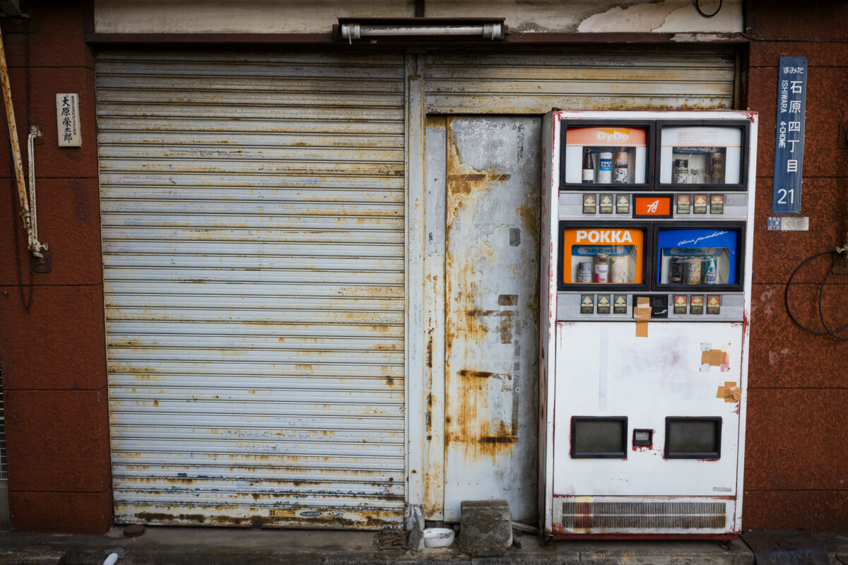 An old, broken and unique old Japanese vending machine