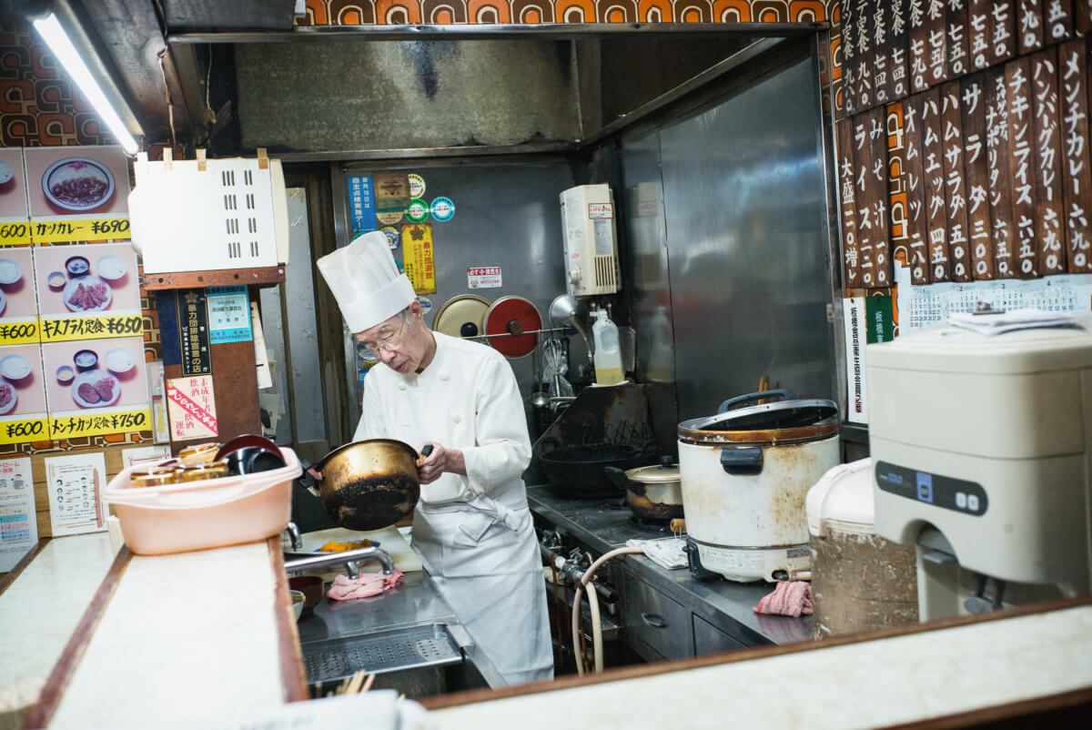 an old Japanese chef in an old Tokyo restaurant