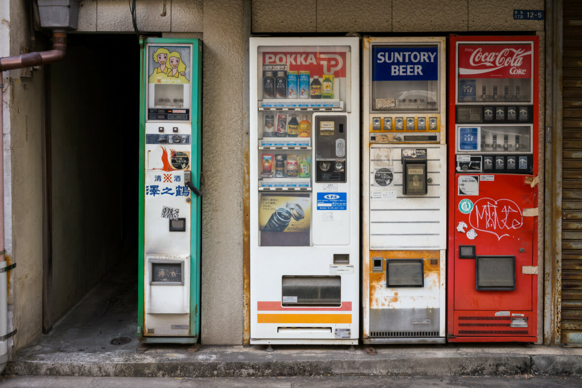 The rust and broken vending machines of an old Tokyo liquor store