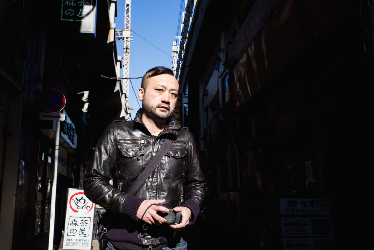 candid photograph of a tokyo street photographer