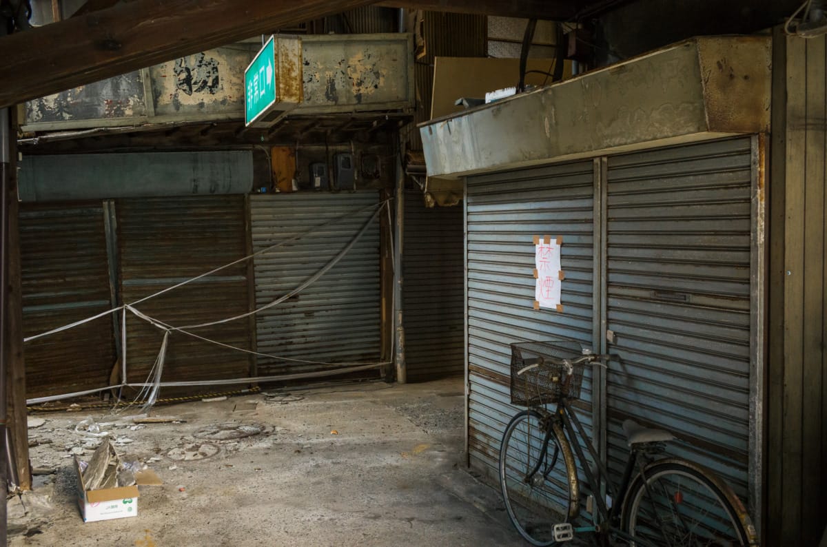 dilapidated pre-war and wooden Japanese shopping street