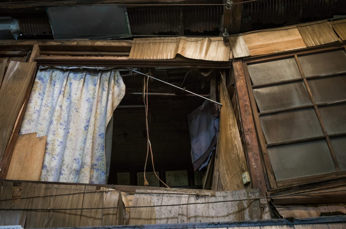 dilapidated pre-war and wooden Japanese shopping street