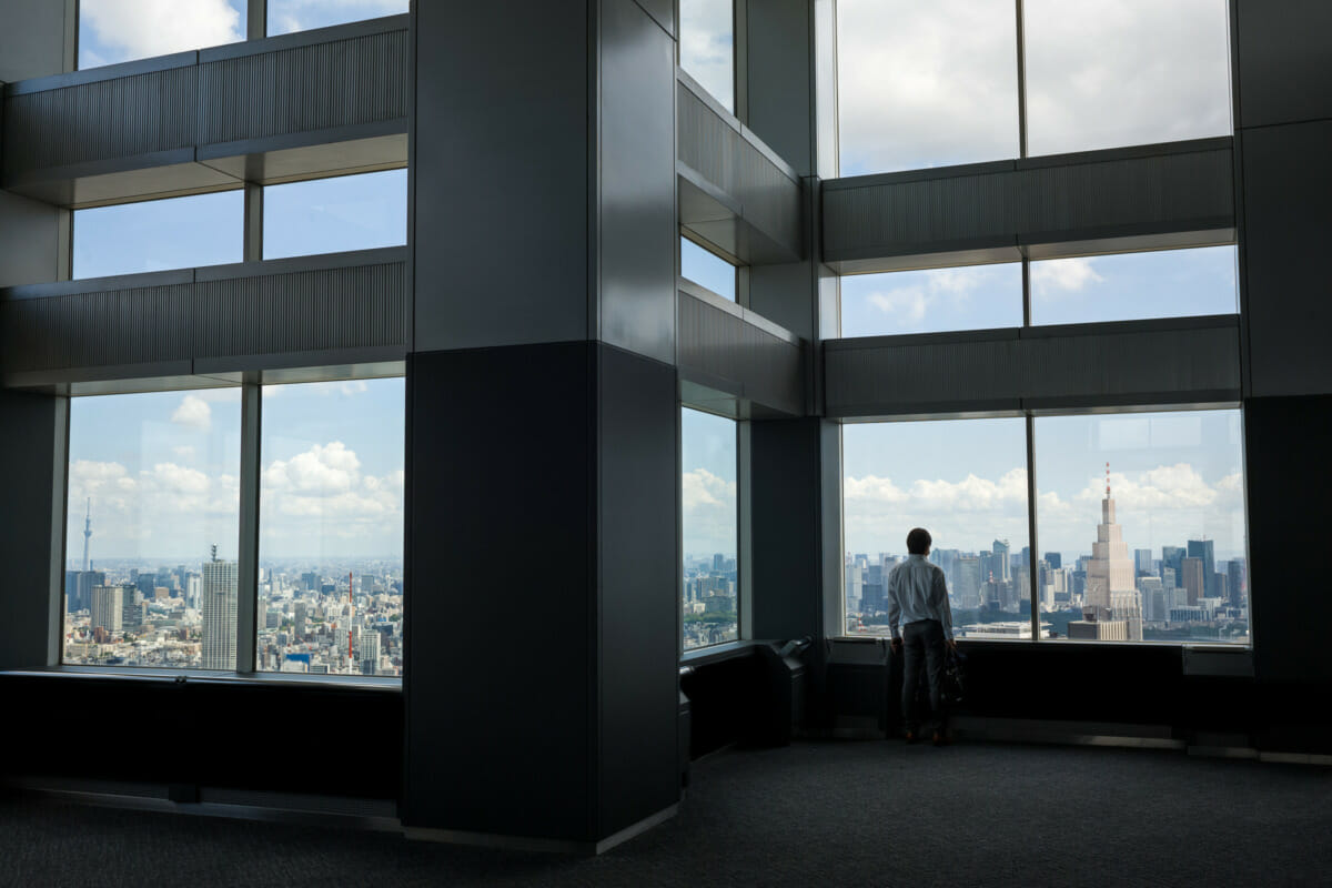 a man standing all alone in Tokyo