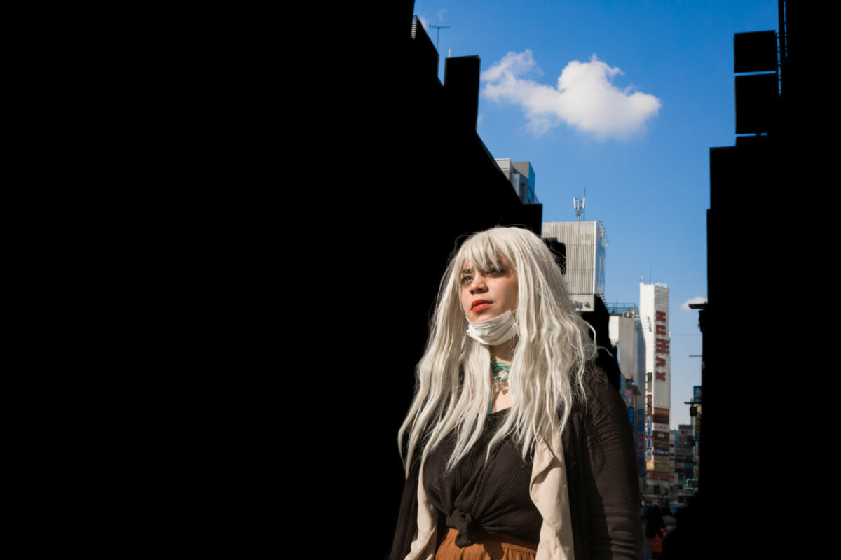 a striking young woman in striking Tokyo light