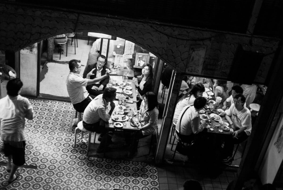 lone woman looks in an old Tokyo bar