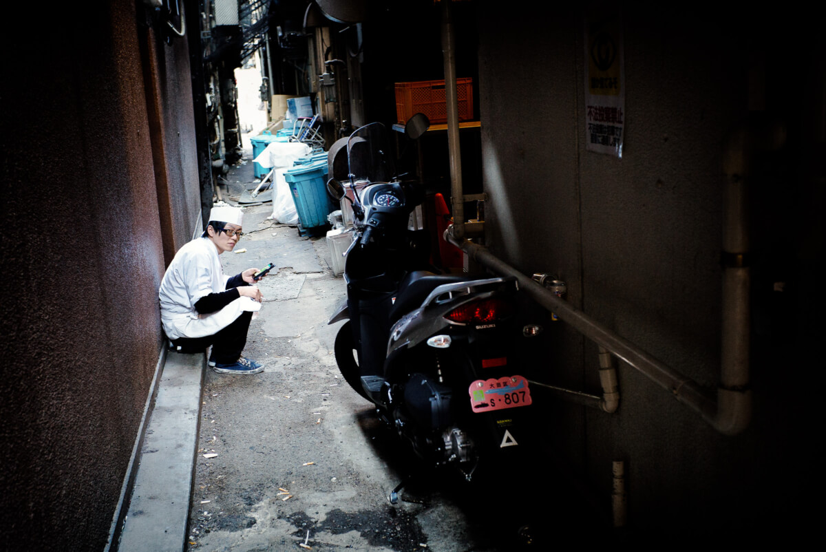 break time in a dirty tokyo alley