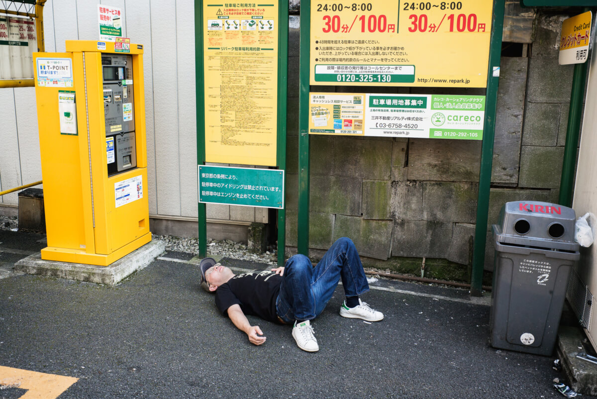 Japanese man drunk in a Tokyo car park