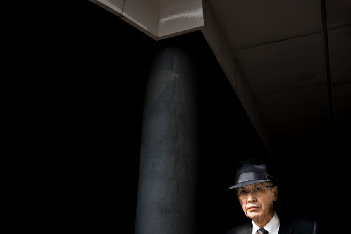 A Tokyo salary man emerging from the shadows