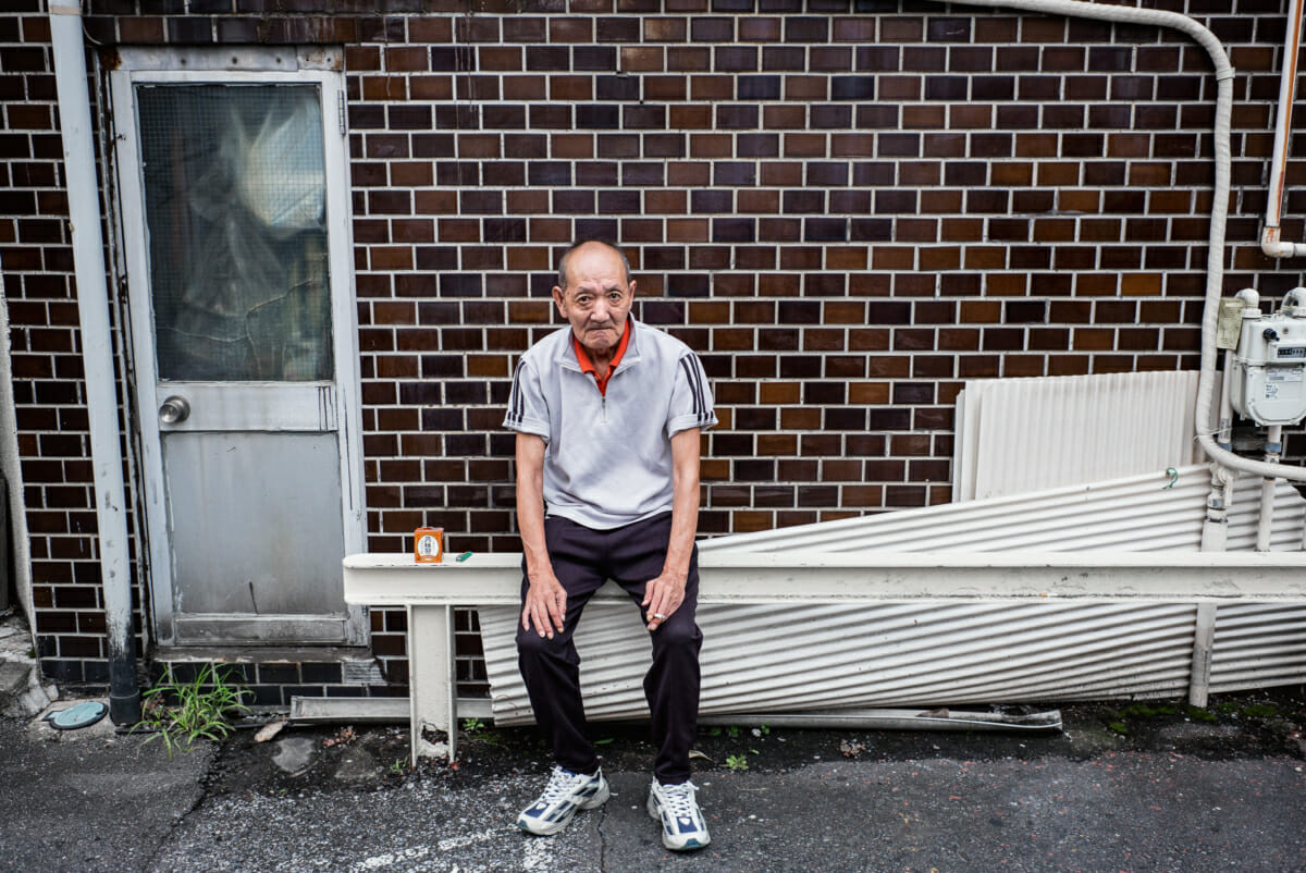 Tokyo street portrait of an old Japanese drinker