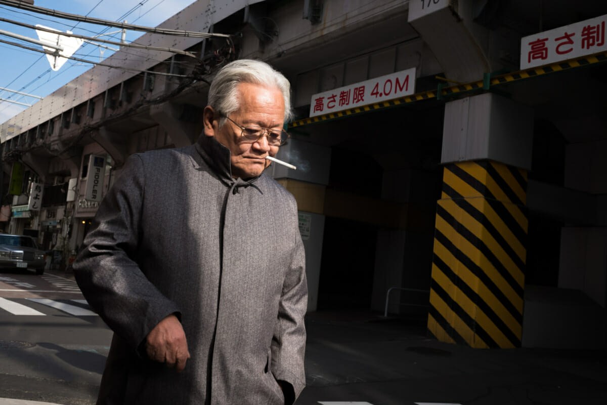 an old Japanese man smoking