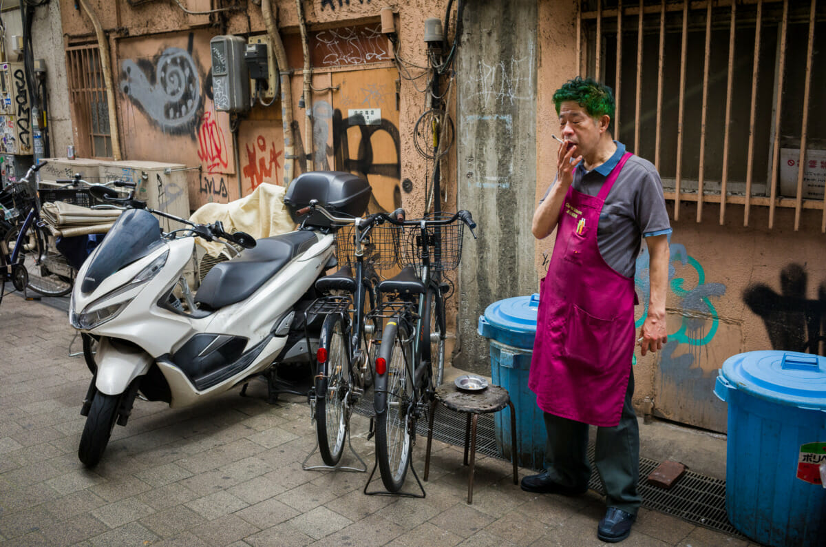 A Tokyo man having a much needed cigarette break