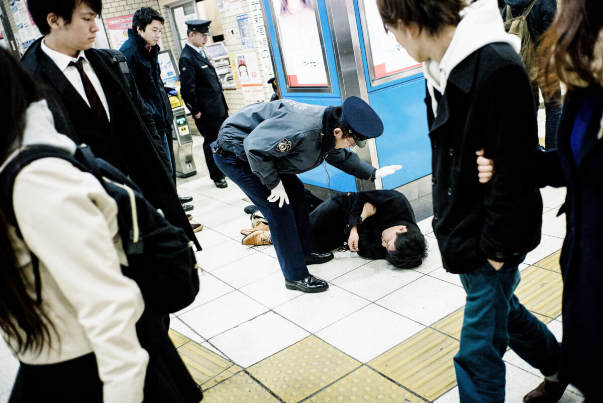 drunk man at a Tokyo train station